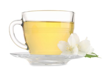 Aromatic herbal tea in glass cup and flowers isolated on white