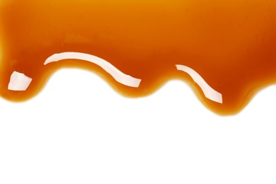 Delicious caramel sauce on white background