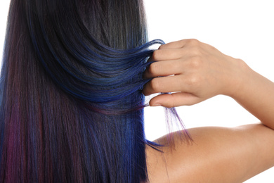 Photo of Young woman with bright dyed hair on white background, back view. Closeup