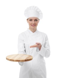 Happy chef in uniform holding empty wooden board on white background