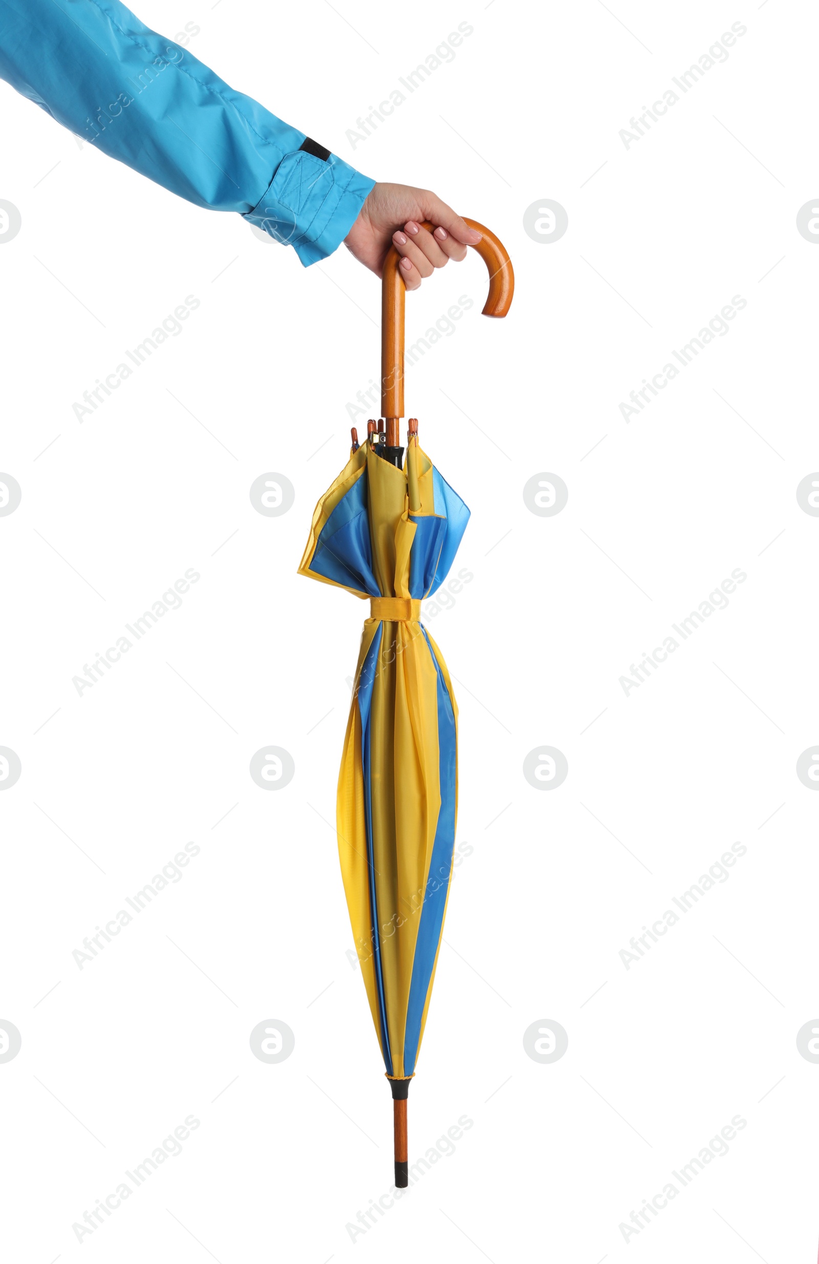 Photo of Woman with closed bright umbrella on white background, closeup