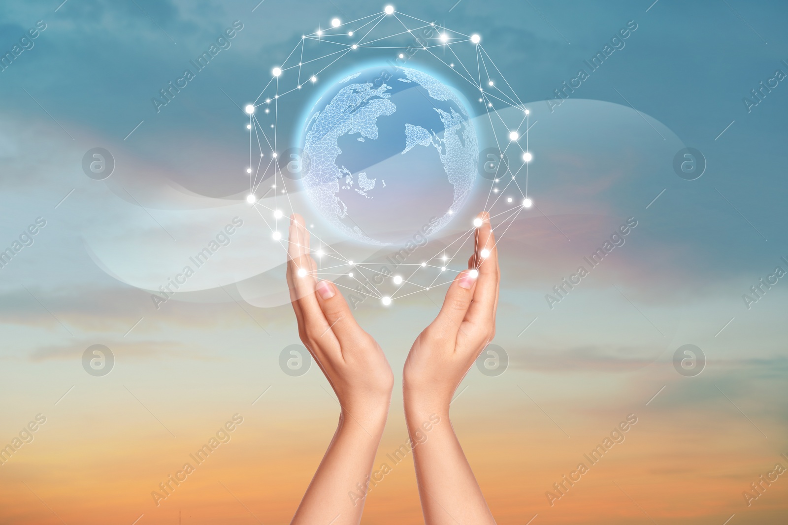 Image of Global innovation. Woman holding virtual planet against sky at sunrise, closeup