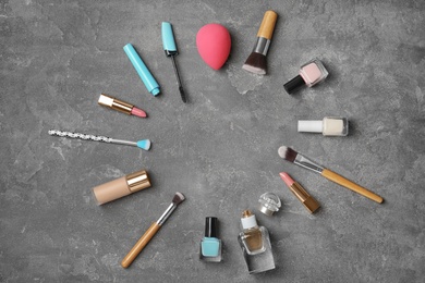 Flat lay composition with cosmetic products on grey background