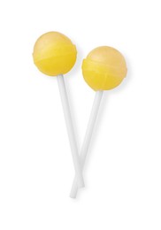 Photo of Two sweet yellow lollipops isolated on white, top view