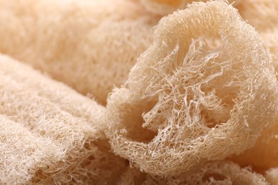 Natural loofah sponges as background, closeup view