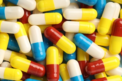 Photo of Many antibiotic pills as background, top view