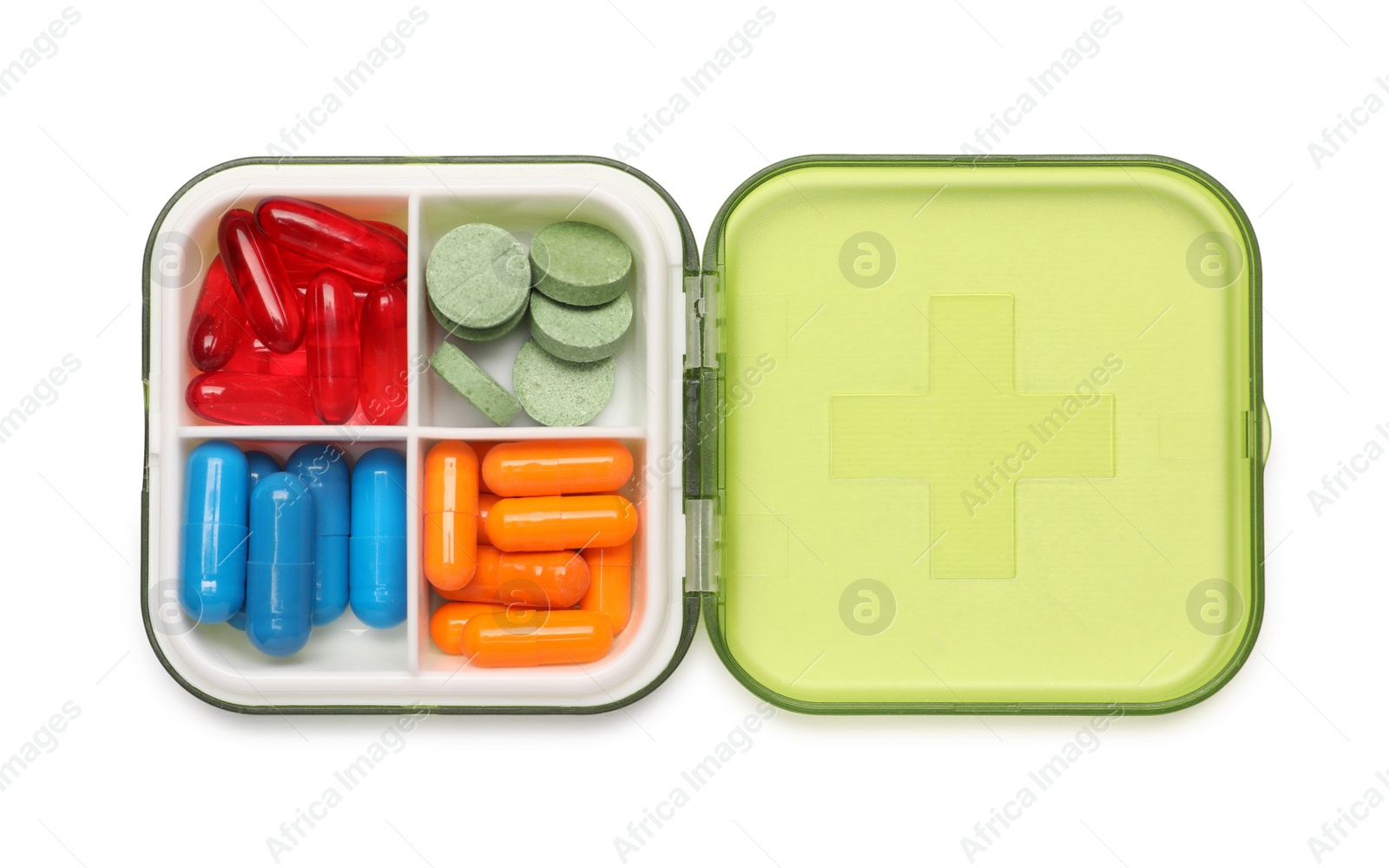 Photo of Different pills in organizer isolated on white, top view