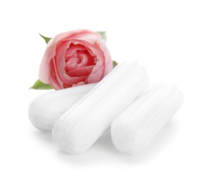 Tampons and beautiful rose on white background