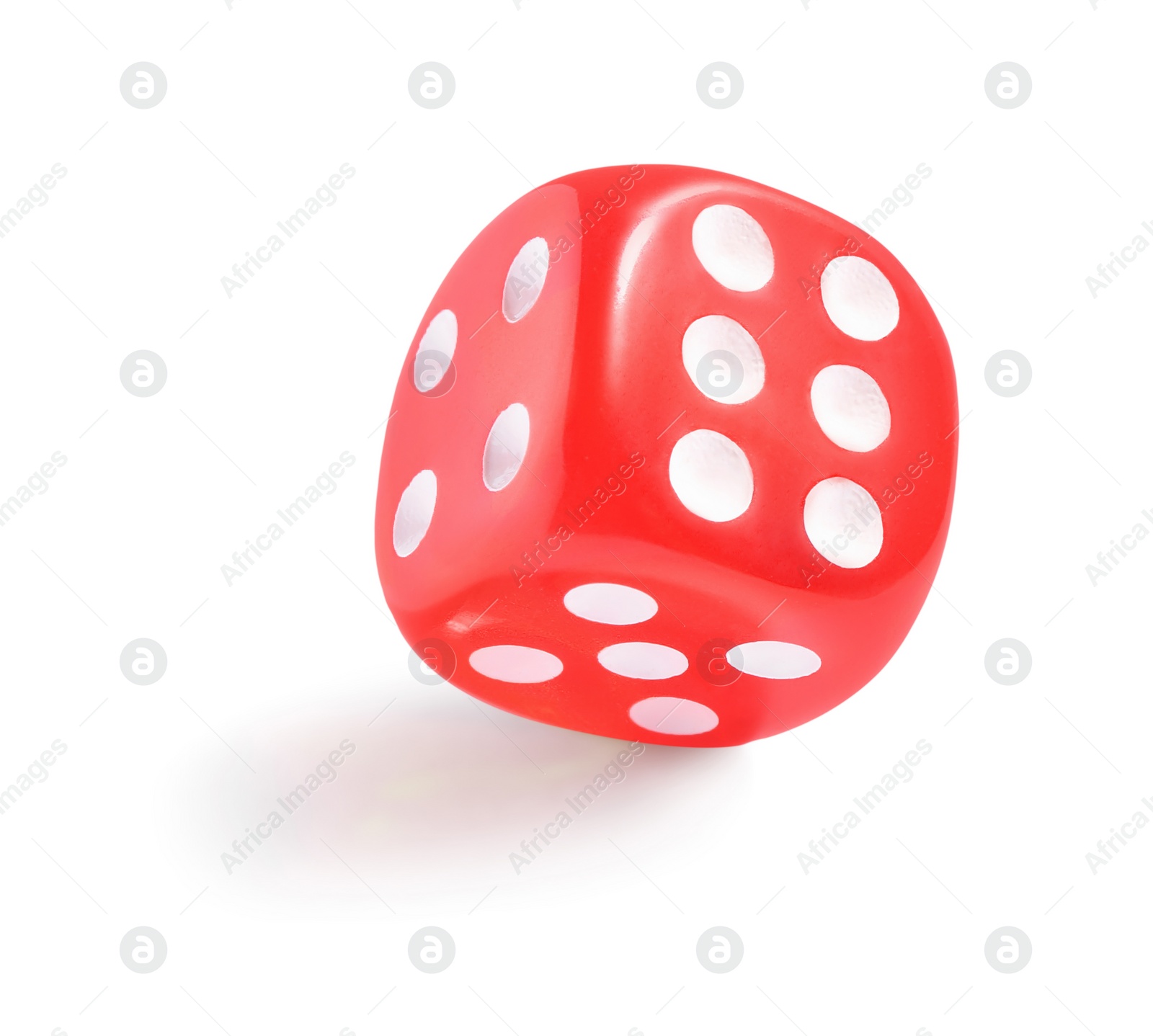 Photo of One red game dice isolated on white