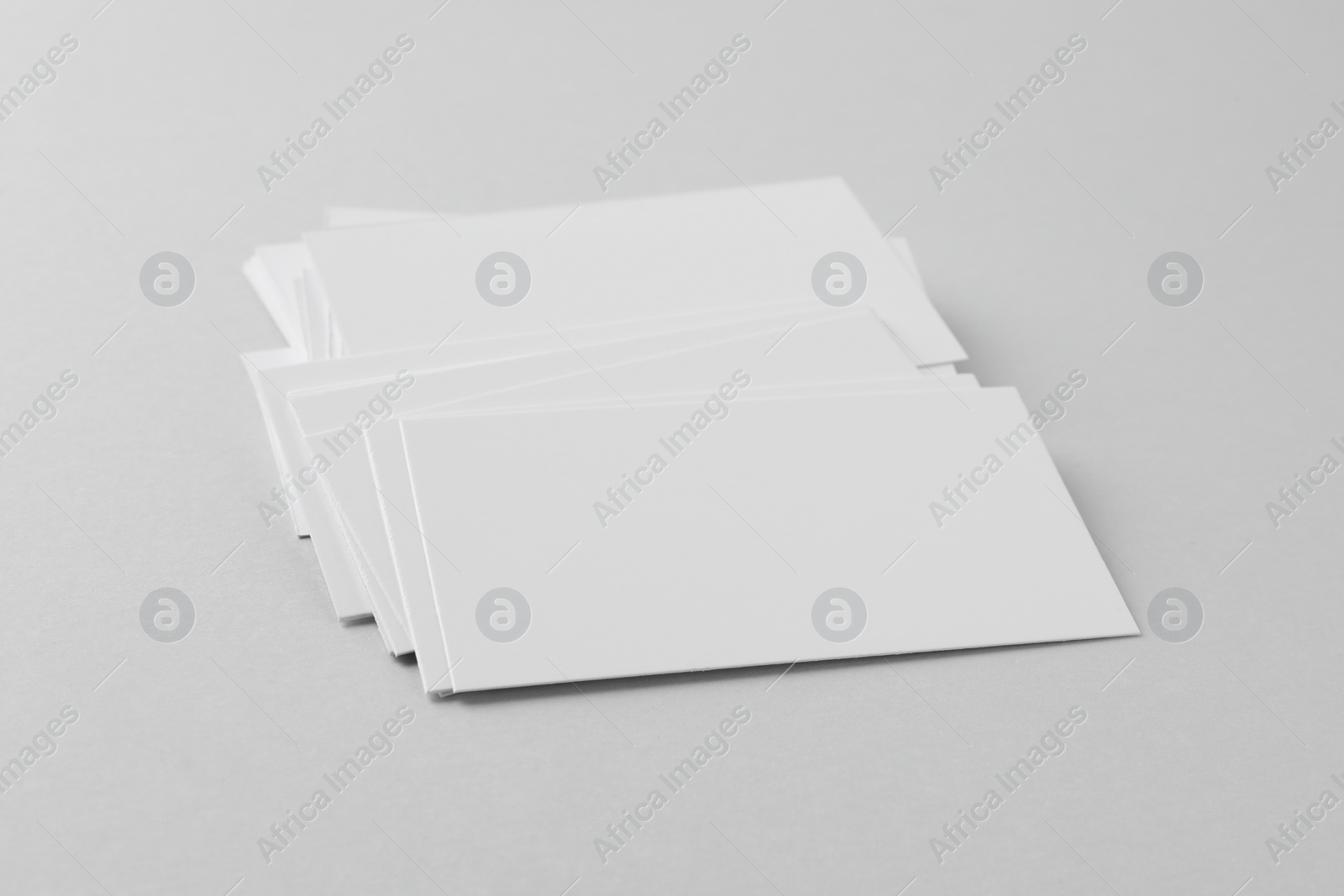 Photo of Blank business cards on light grey background. Mockup for design