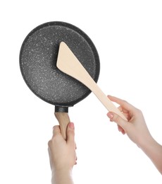 Photo of Woman with spatula and frying pan on white background, closeup