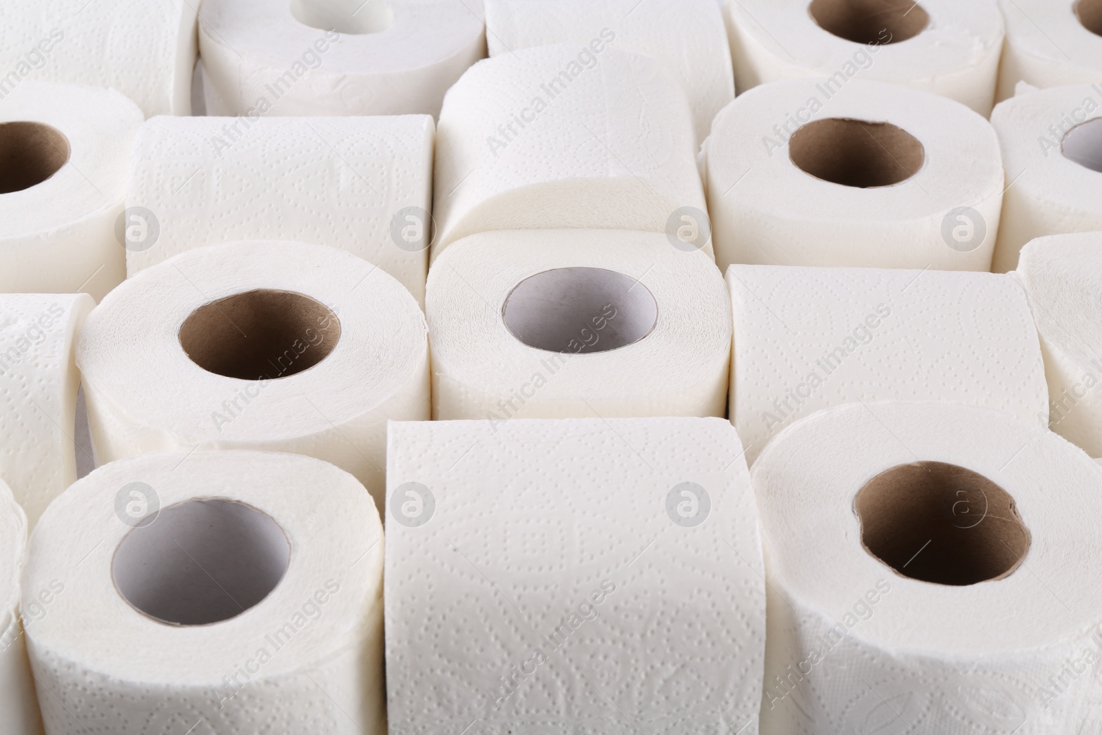 Photo of Many soft toilet paper rolls as background, closeup