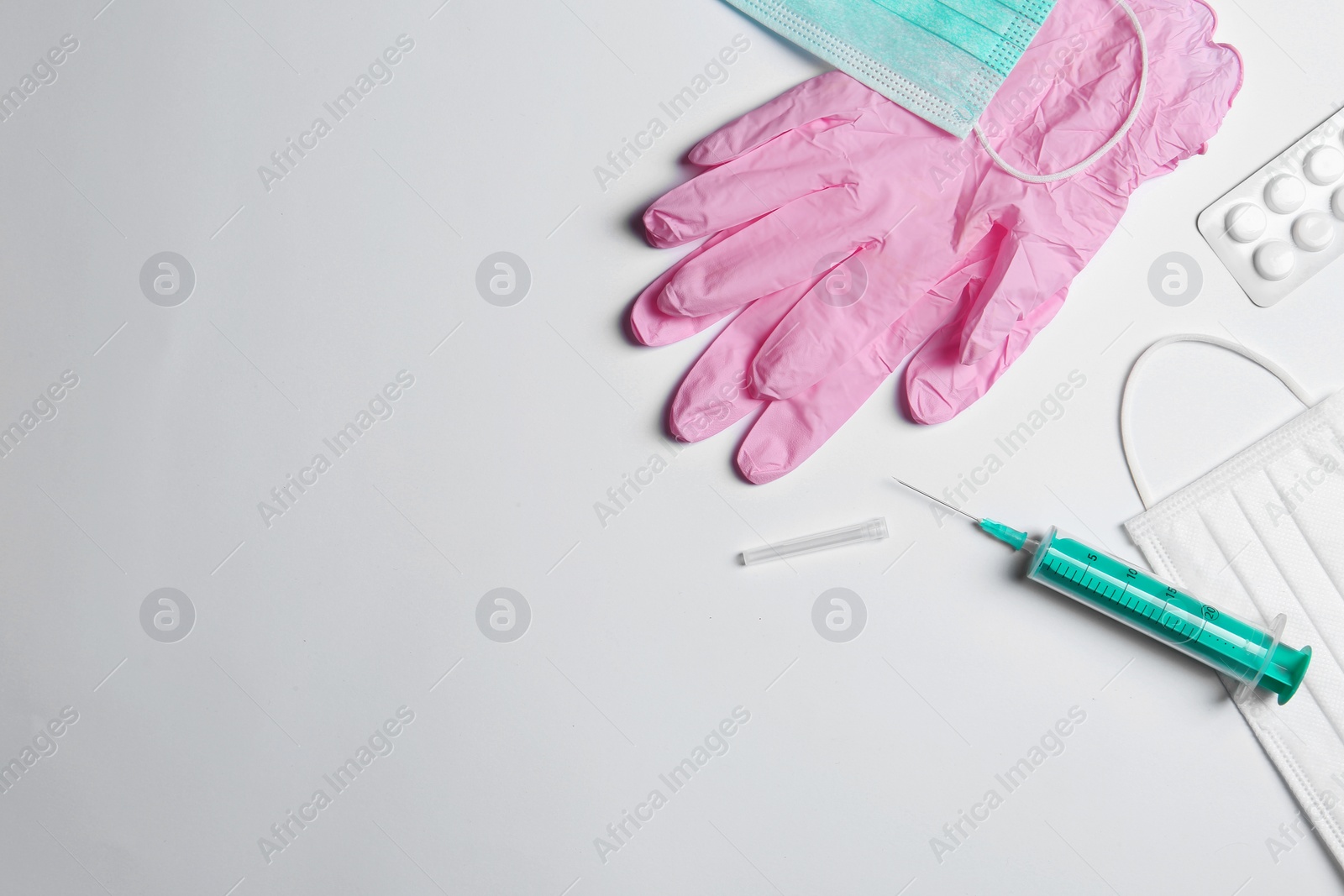 Photo of Flat lay composition with medical gloves on white background. Space for text