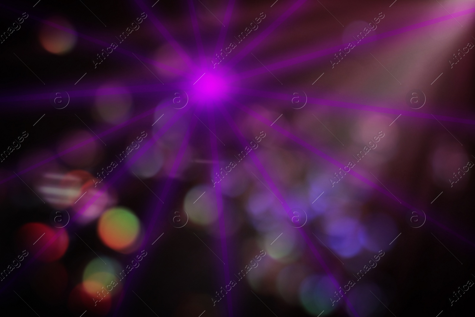 Image of Beams of light in darkness of night club, bokeh effect