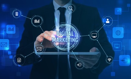 Image of Digital marketing, banner design. Businessman with tablet using virtual screen, closeup. Scheme with icons over device