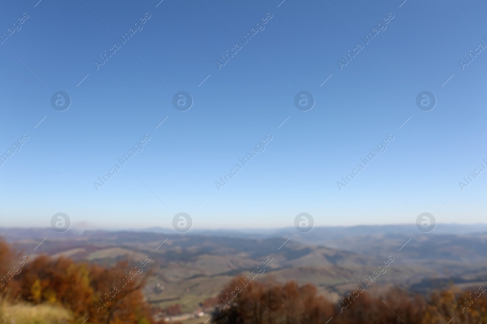 Photo of Beautiful mountain landscape with blue sky on sunny day, blurred view