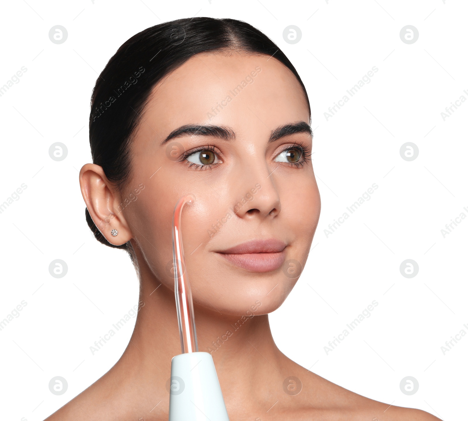 Photo of Woman using high frequency darsonval device on white background