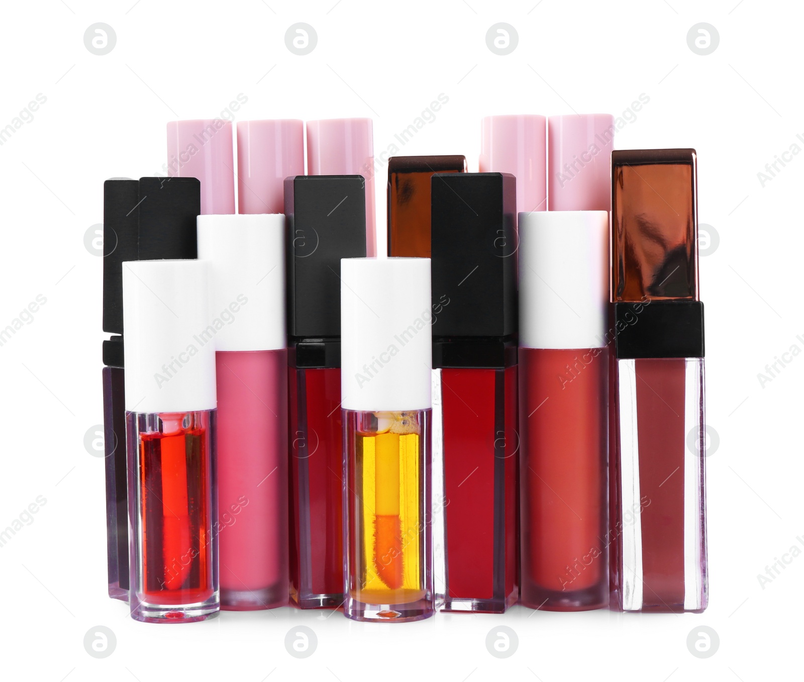 Photo of Many different lip glosses isolated on white