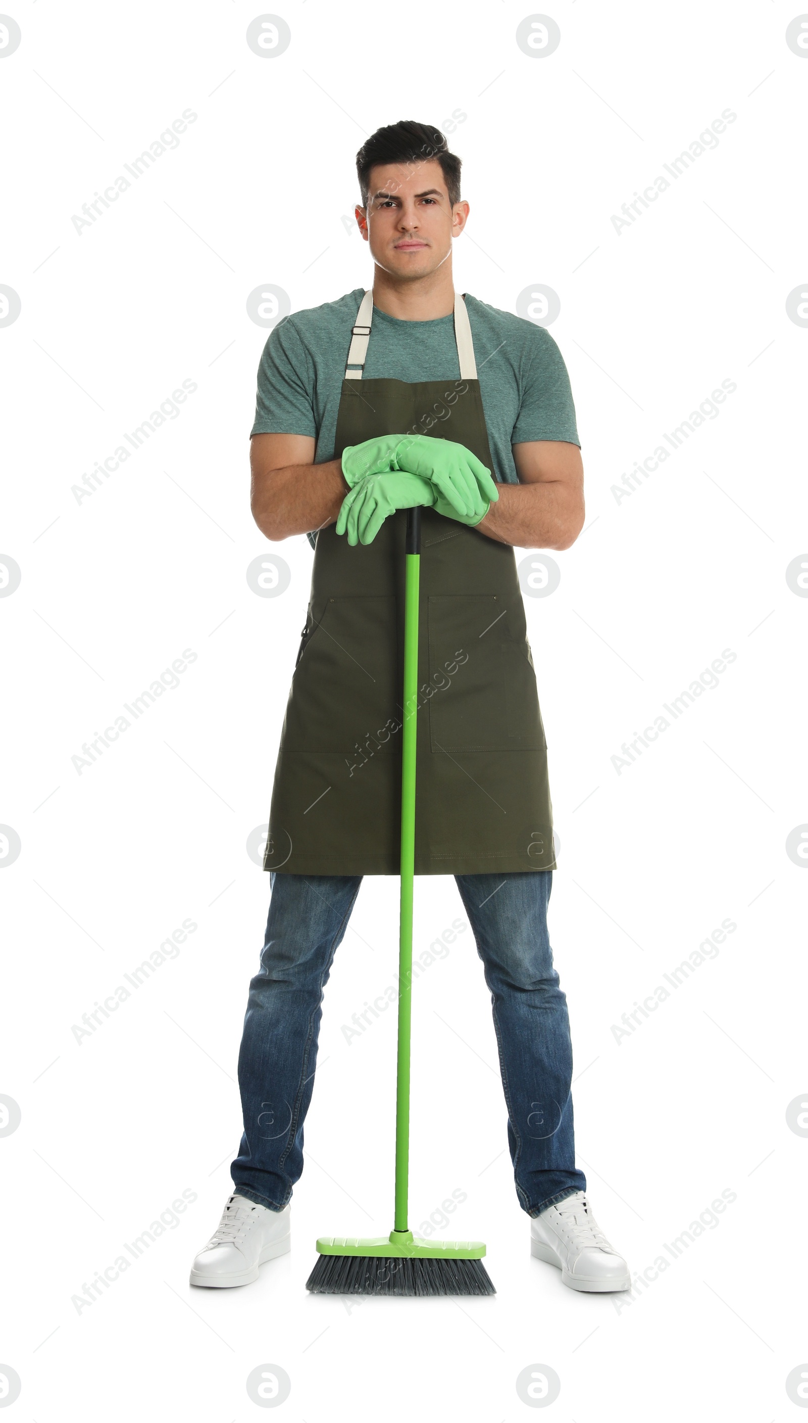 Photo of Man with green broom on white background