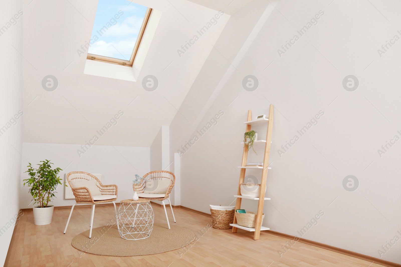 Photo of Attic room with stylish wooden furniture. Interior design