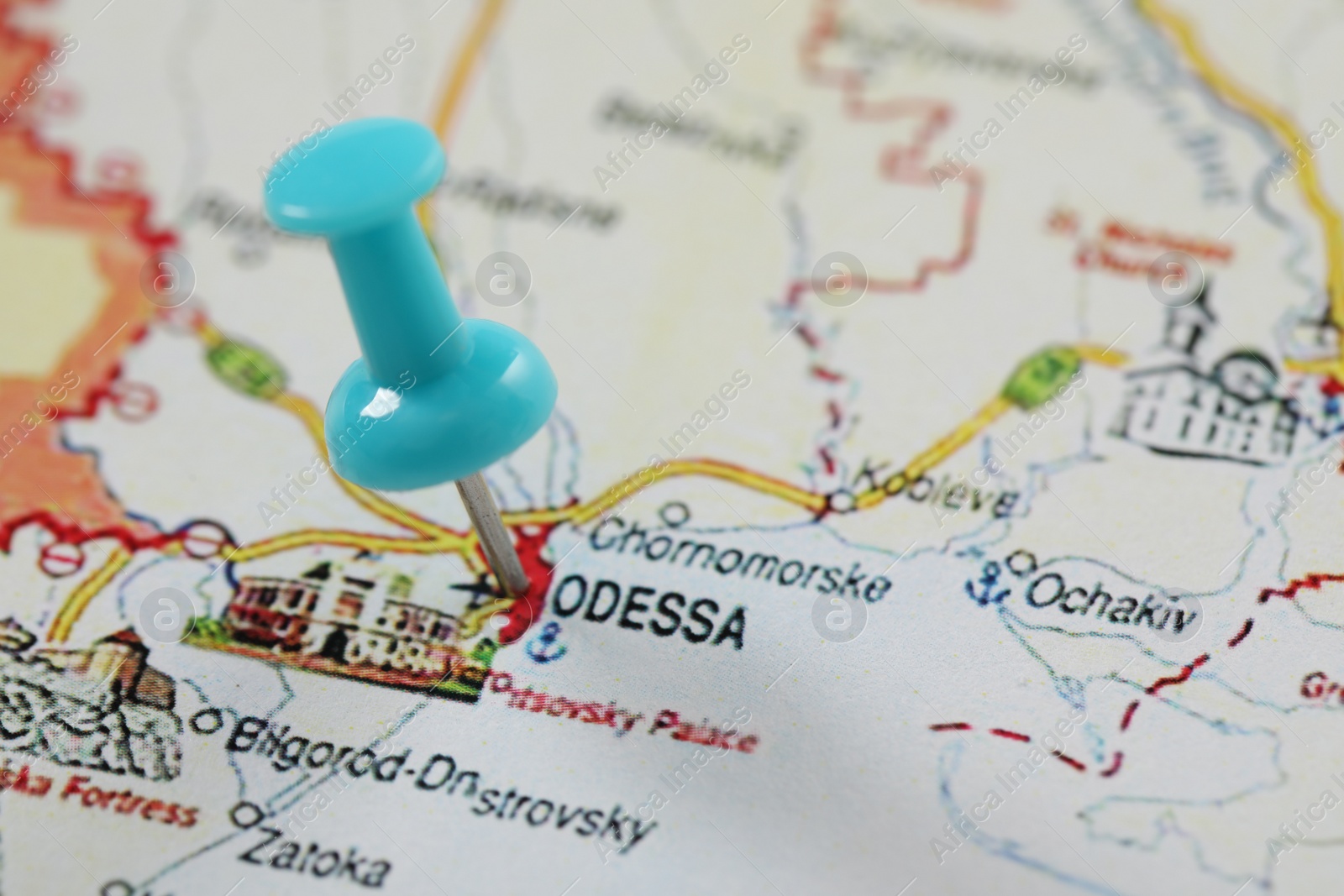 Photo of MYKOLAIV, UKRAINE - NOVEMBER 09, 2020: Odesa city marked with push pin on map of Ukraine, closeup