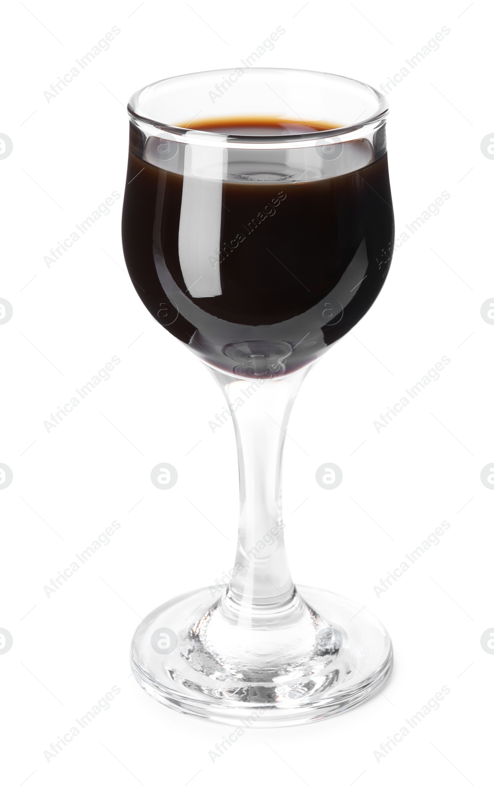 Photo of Shot glass with coffee liqueur isolated on white