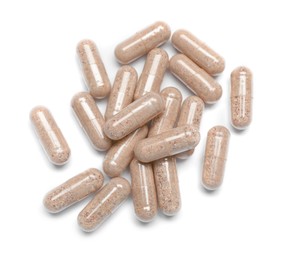 Photo of Many transparent gelatin capsules on white background, top view