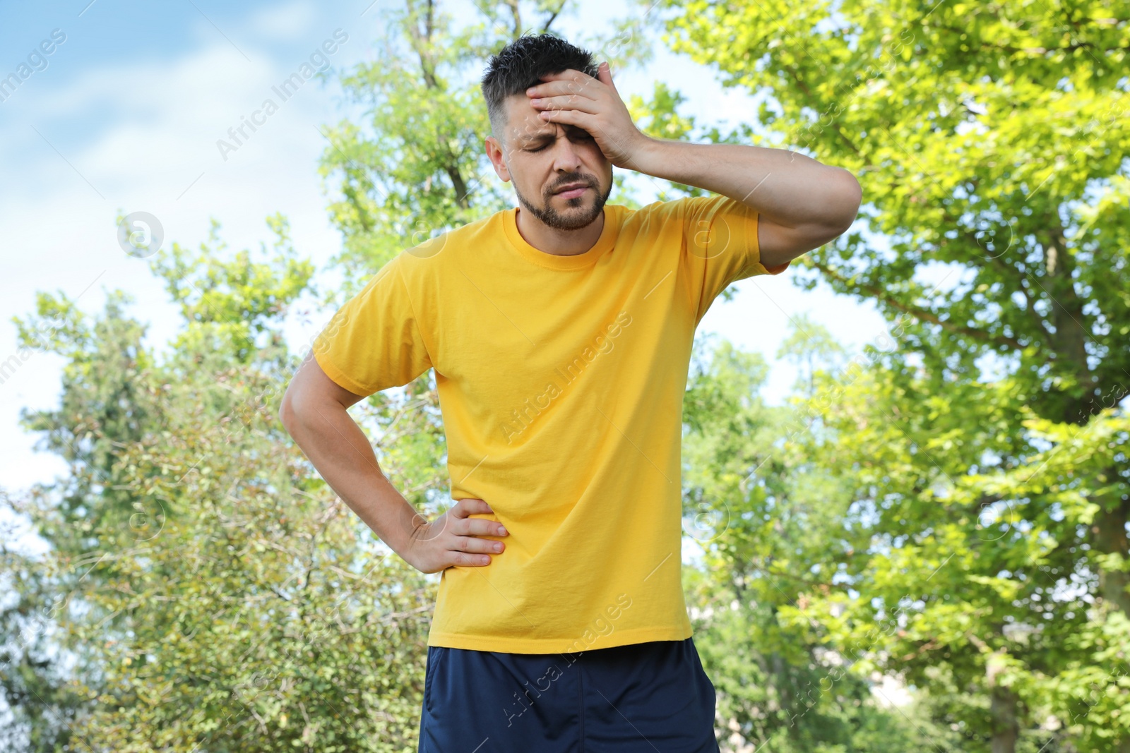 Photo of Man suffering from heat stroke in park