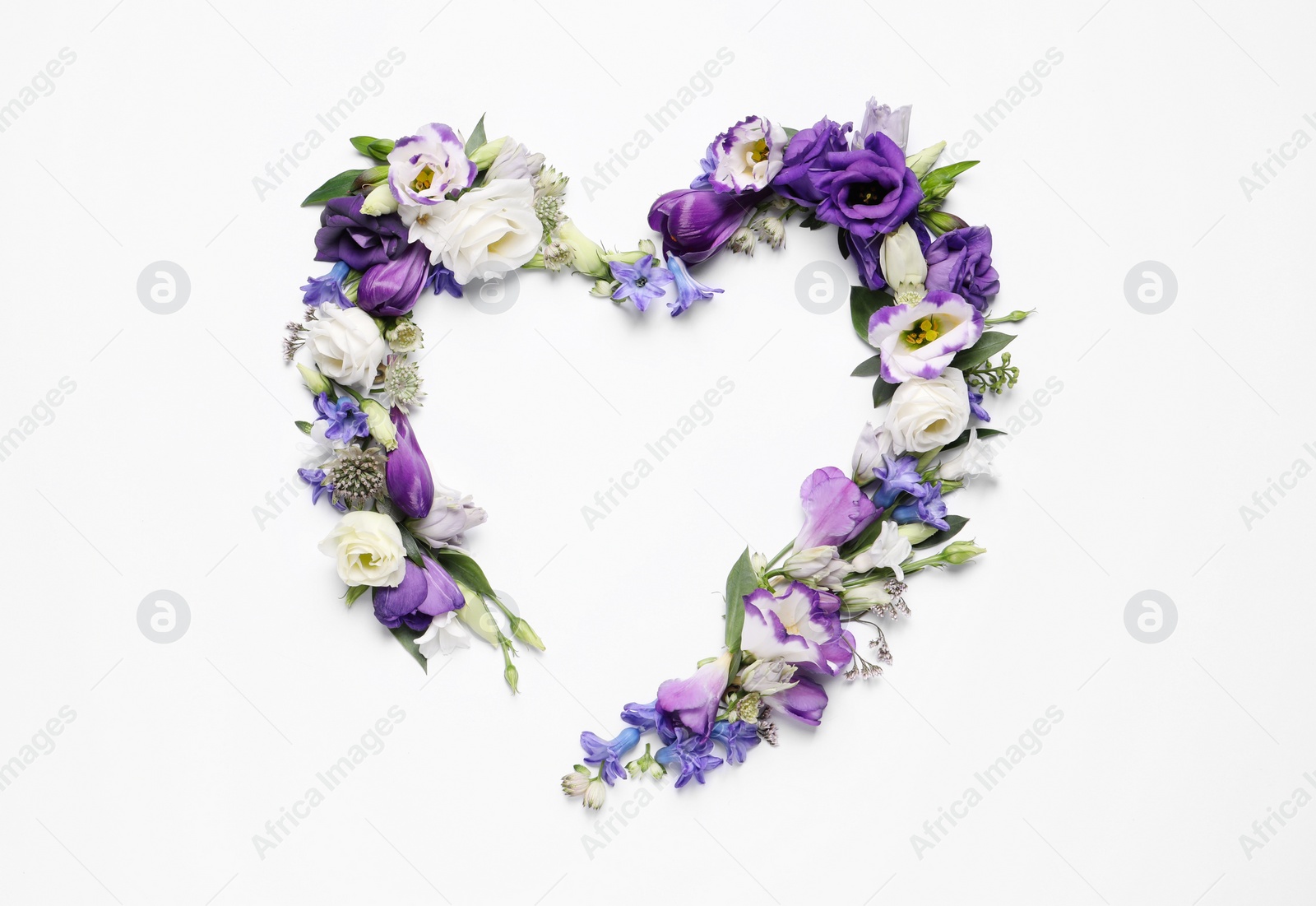 Photo of Beautiful heart made of different flowers on white background, top view