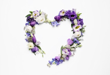 Photo of Beautiful heart madedifferent flowers on white background, top view