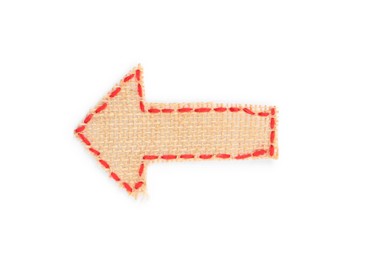 Photo of Arrow made of burlap fabric with red stitches isolated on white, top view