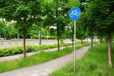 Photo of Road sign shared lane bicycles on spring day outdoors