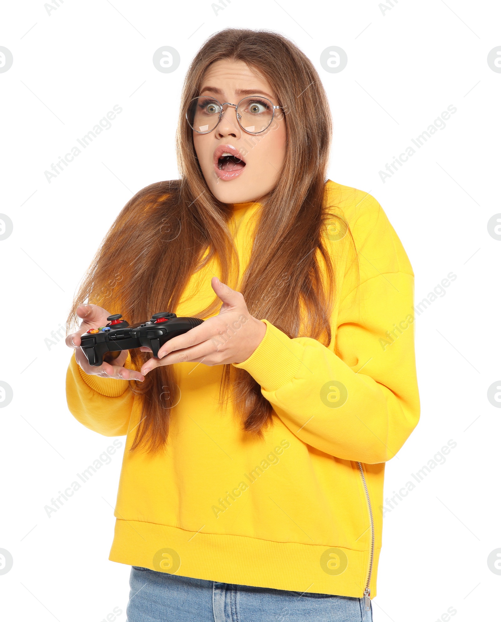 Photo of Emotional young woman playing video games with controller isolated on white