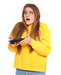Emotional young woman playing video games with controller isolated on white
