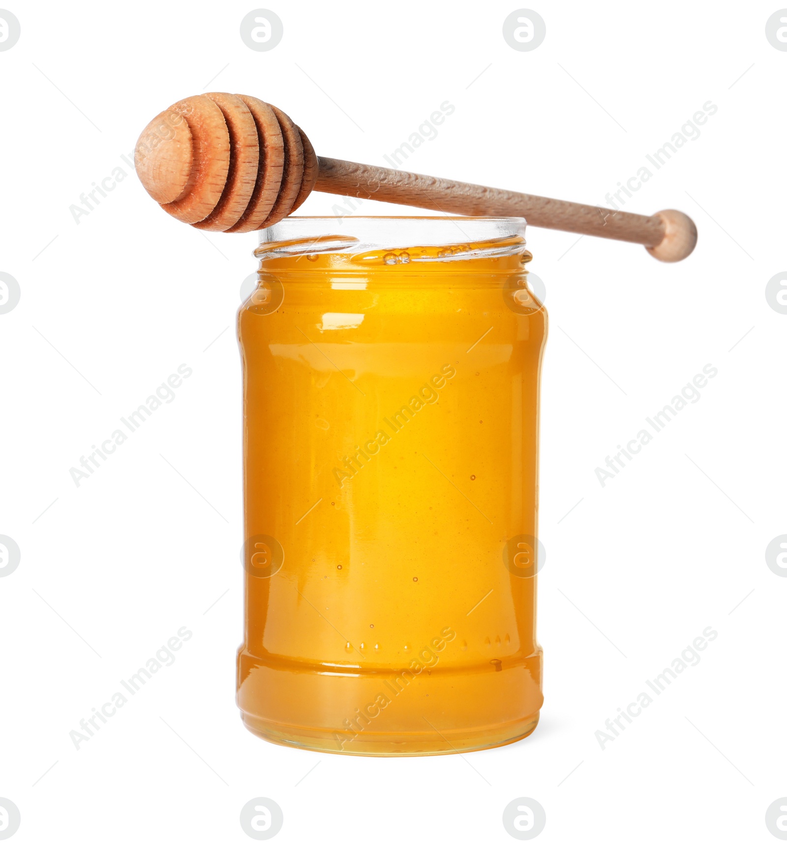 Photo of Tasty natural honey in glass jar and dipper isolated on white