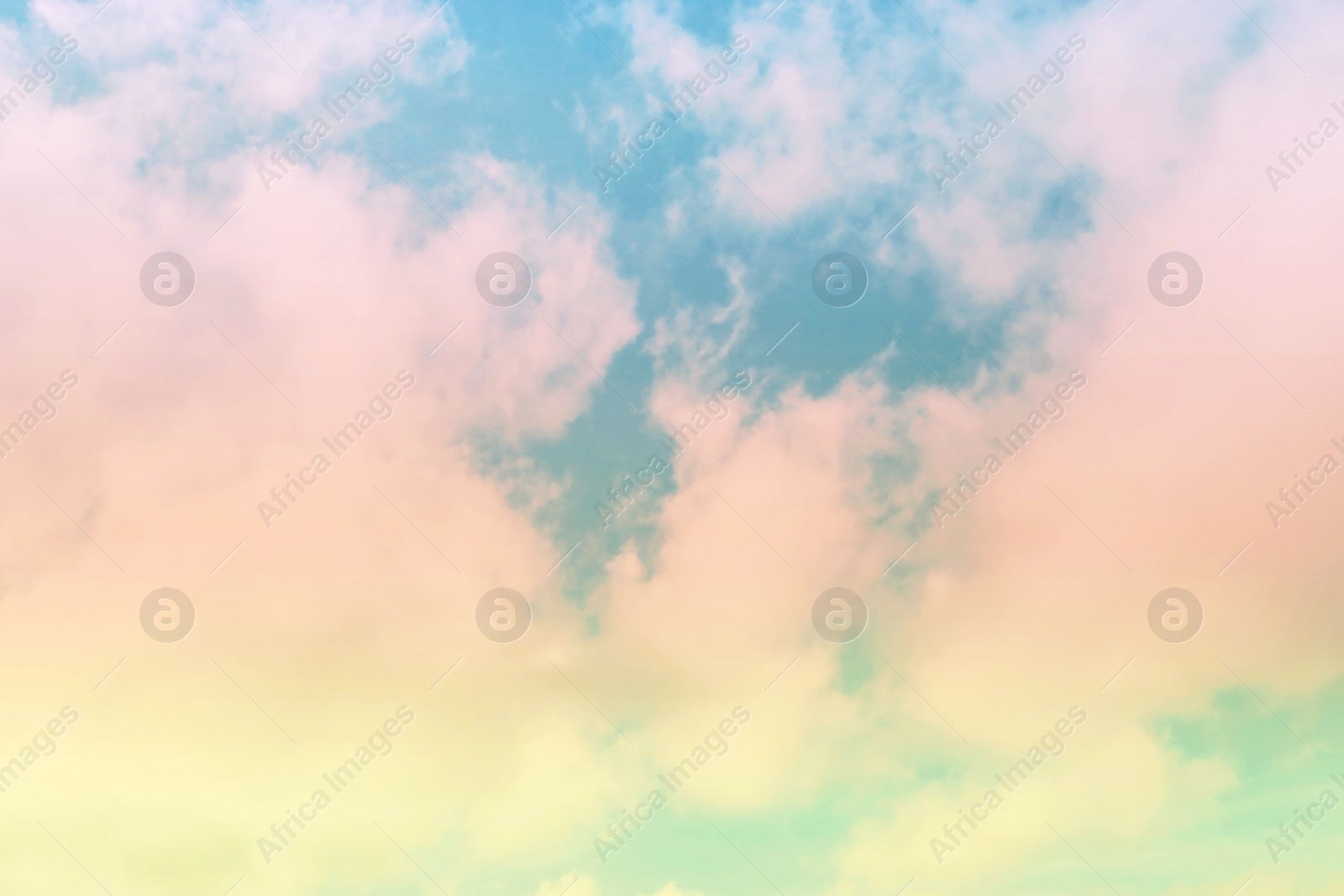 Image of Fantasy world. Picturesque view of beautiful magic sky with fluffy clouds, toned in pastel rainbow or unicorn colors