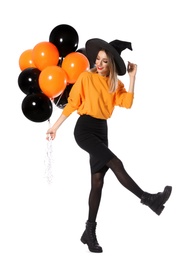 Photo of Beautiful woman wearing witch costume with balloons for Halloween party on white background