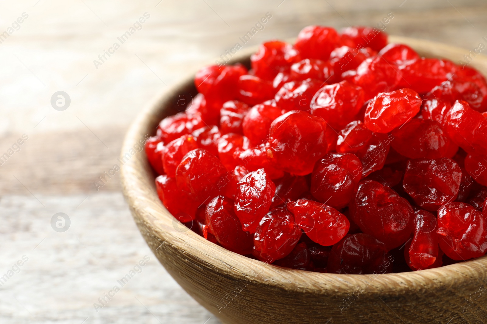 Photo of Bowl of sweet cherries on table, closeup. Dried fruit as healthy snack