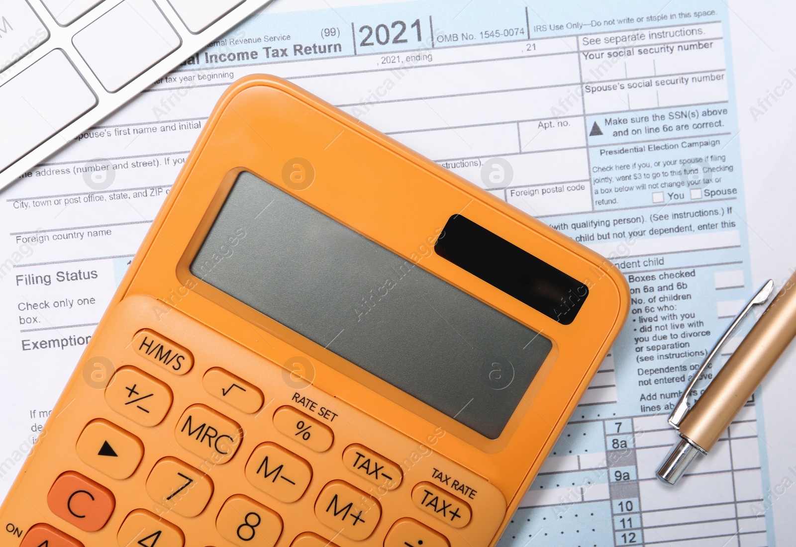 Photo of Calculator, keyboard and pen on document, flat lay. Tax accounting