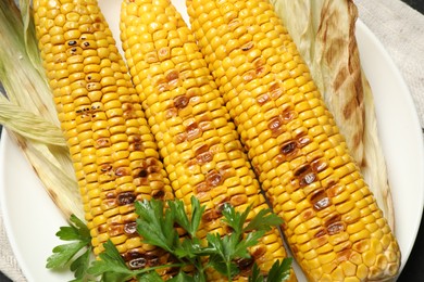 Top view of tasty grilled corn, closeup