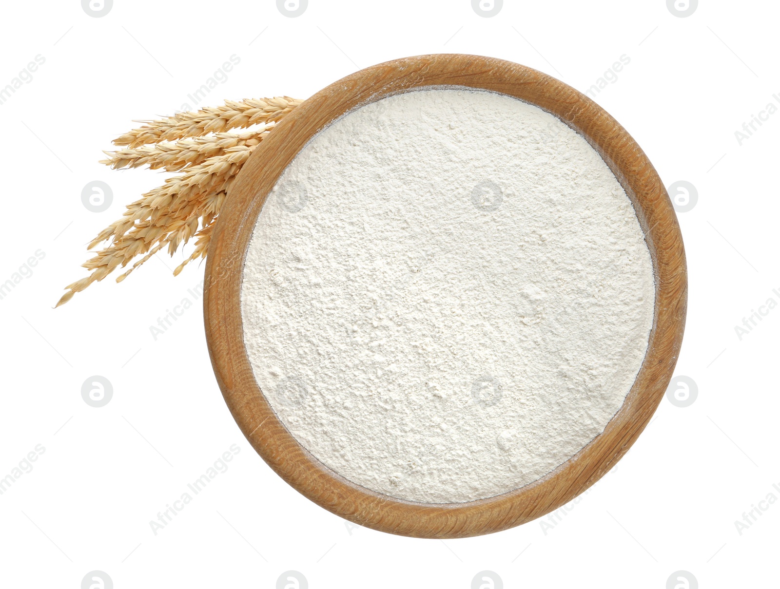 Photo of Organic flour and spikelets isolated on white, top view