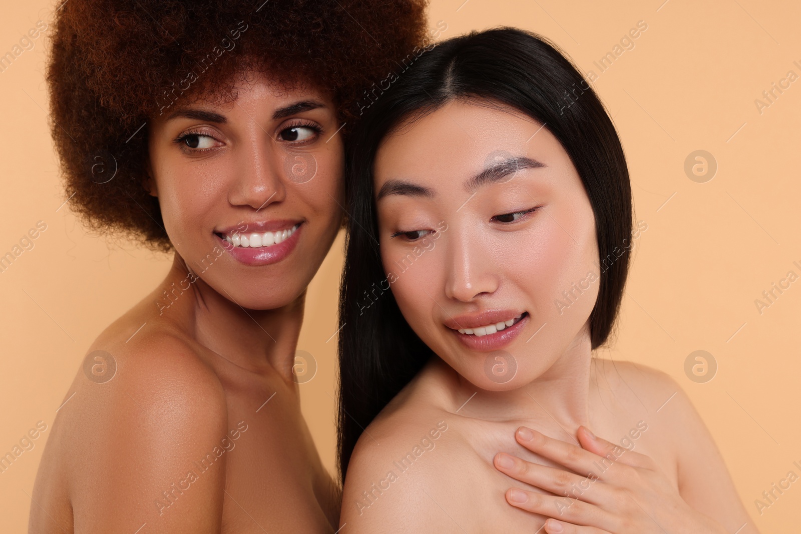 Photo of Portrait of beautiful young women on beige background