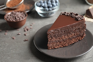 Photo of Delicious fresh chocolate cake served on grey table