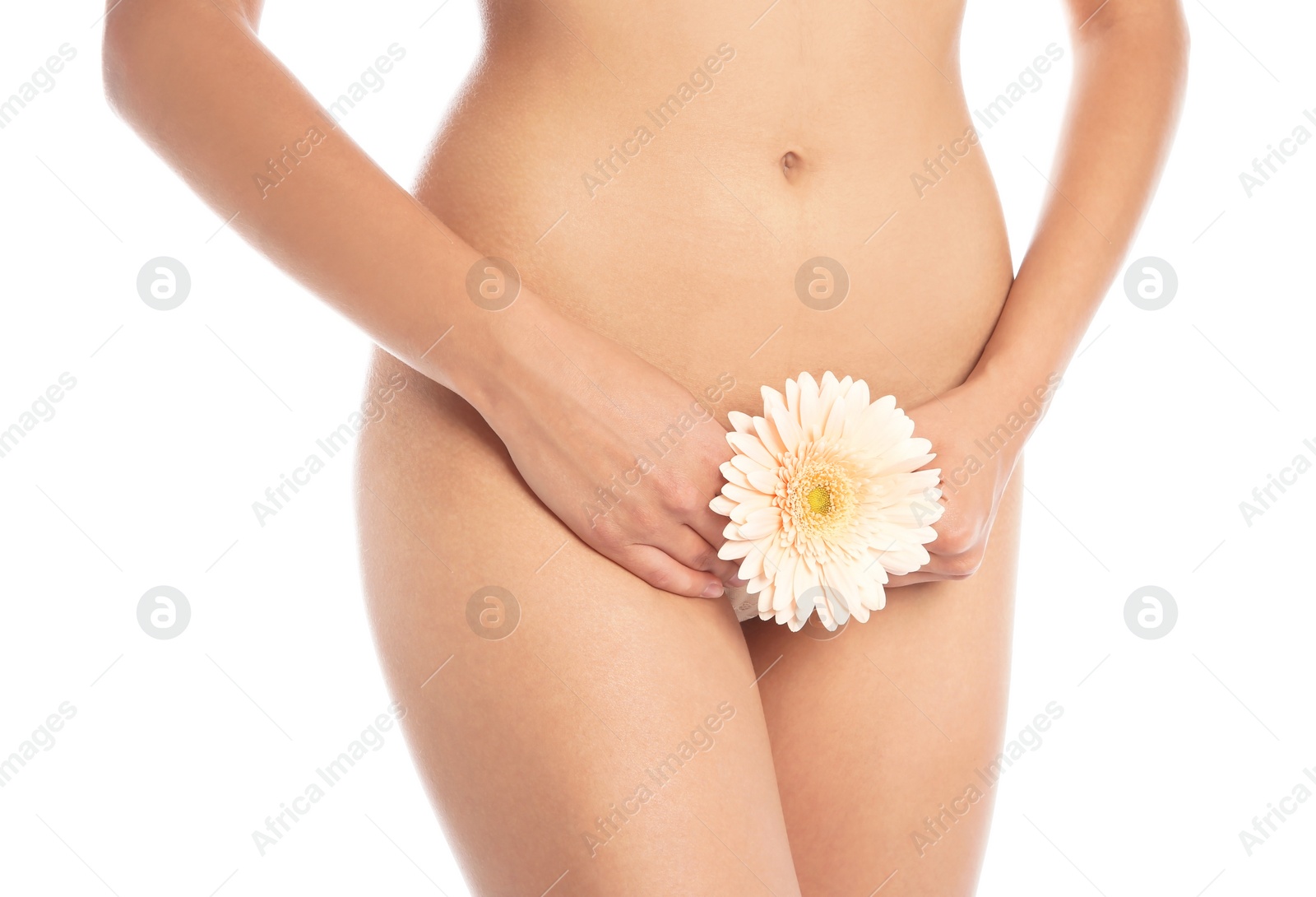 Photo of Young woman with flower showing smooth skin after bikini epilation on white background