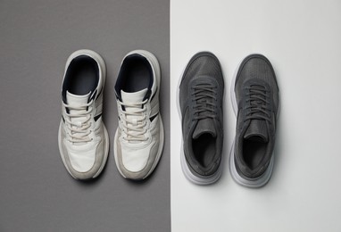 Photo of Different stylish sport shoes on color background, flat lay