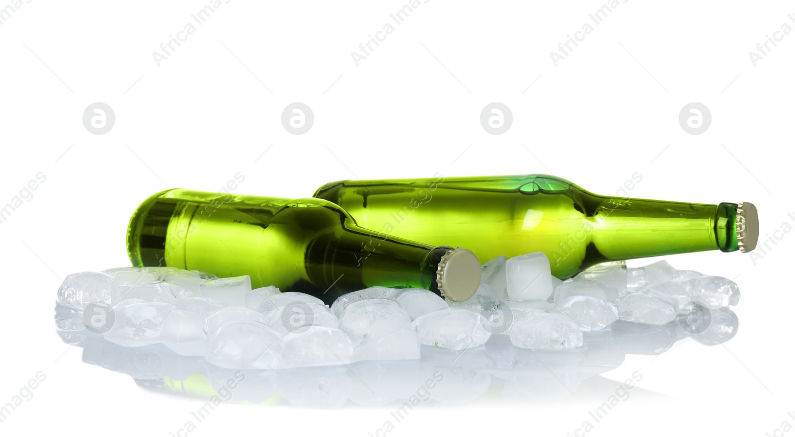 Photo of Bottles of beer and ice cubes on white background