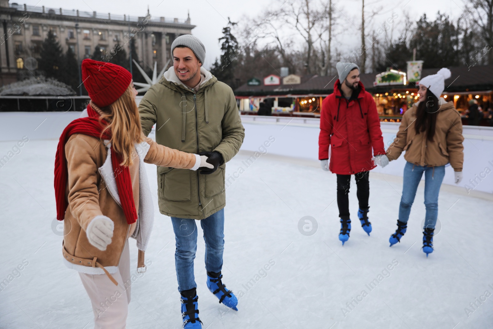 Image of Group of friends at outdoor ice skating rink