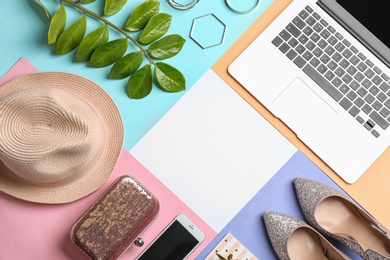 Photo of Flat lay composition with laptop, shoes, hat and space for text on color background. Fashion blogger