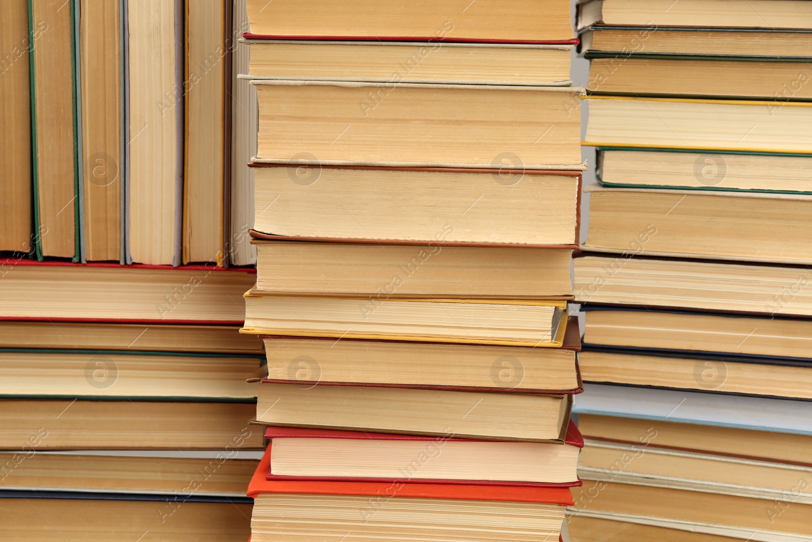 Photo of Many hardcover books as background. Library material