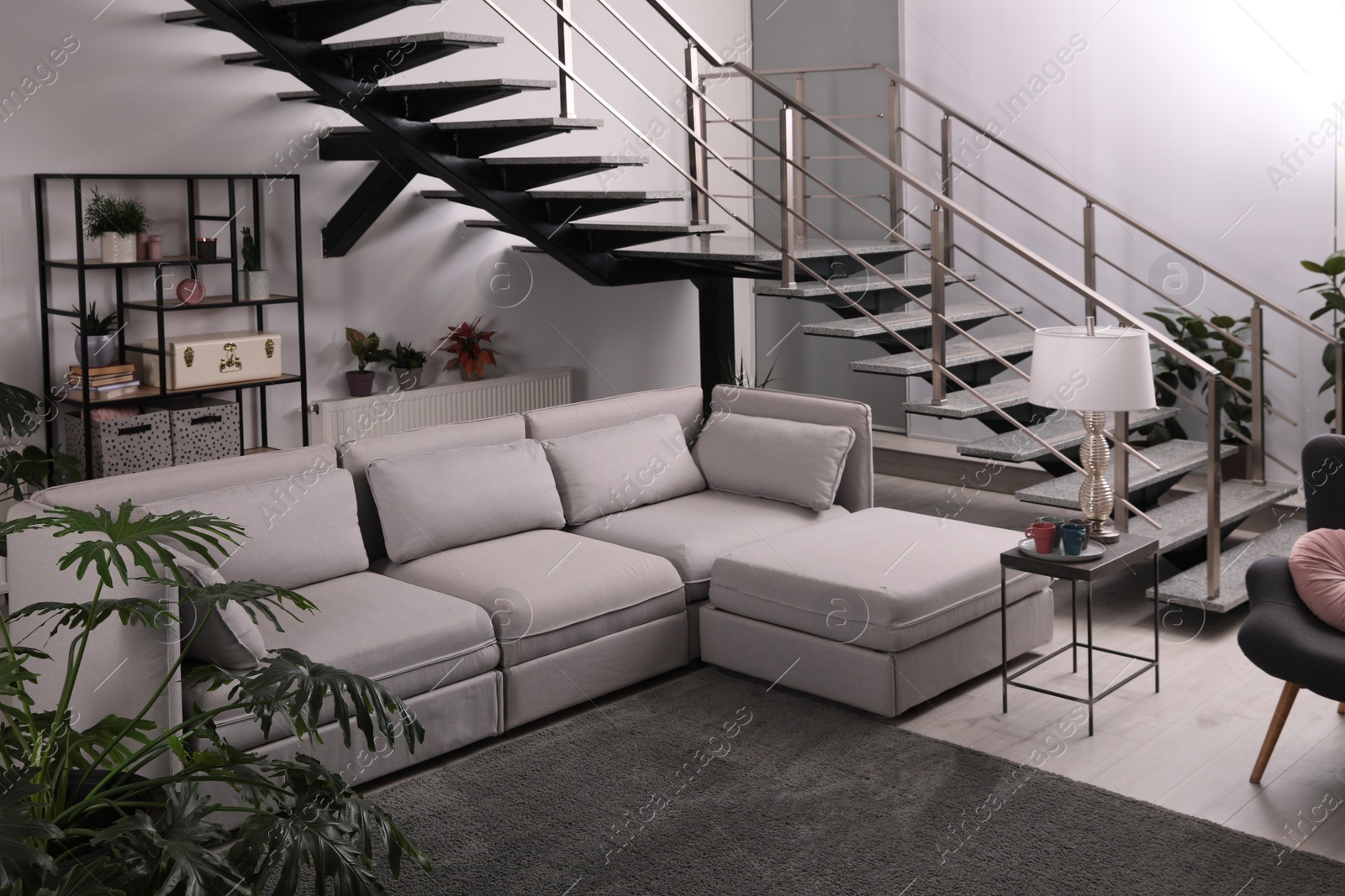 Photo of Stylish living room interior with comfortable sofa